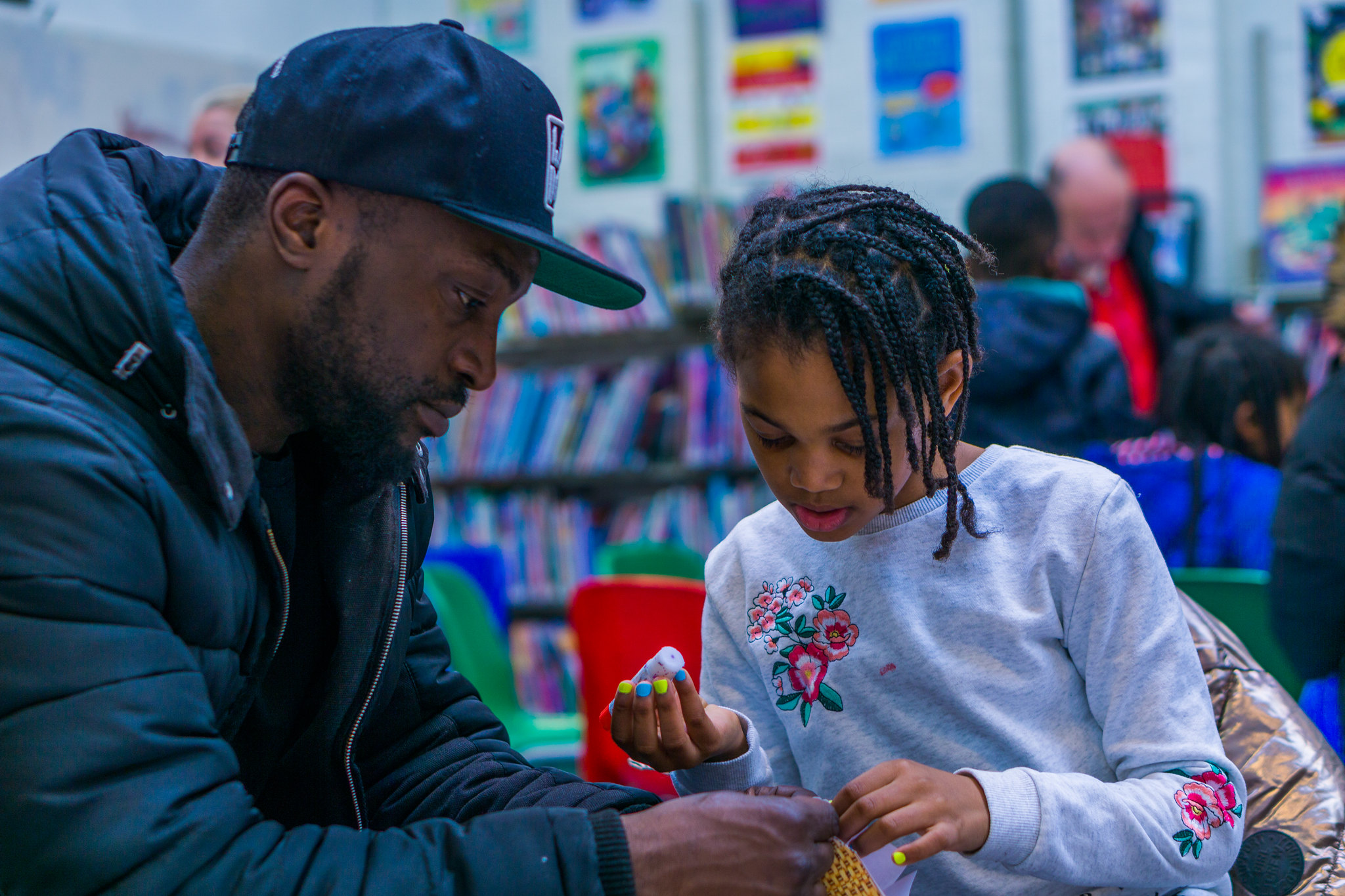 Father and child in a library