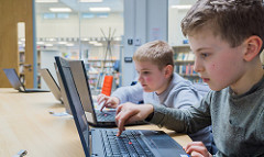 Boy working on a laptop