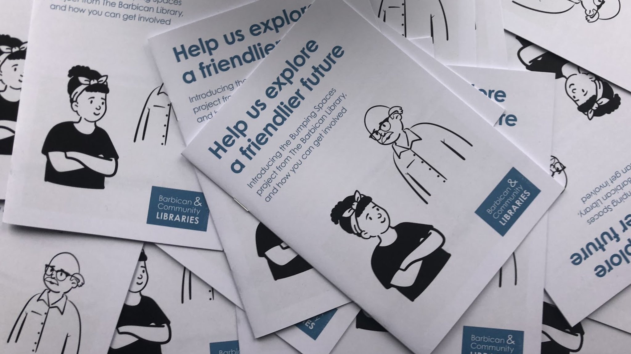 Leaflets for the Bumping Spaces project showing blue lettering on a white background