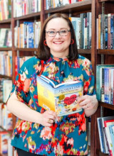 Photo of Amanda Jones holding a book