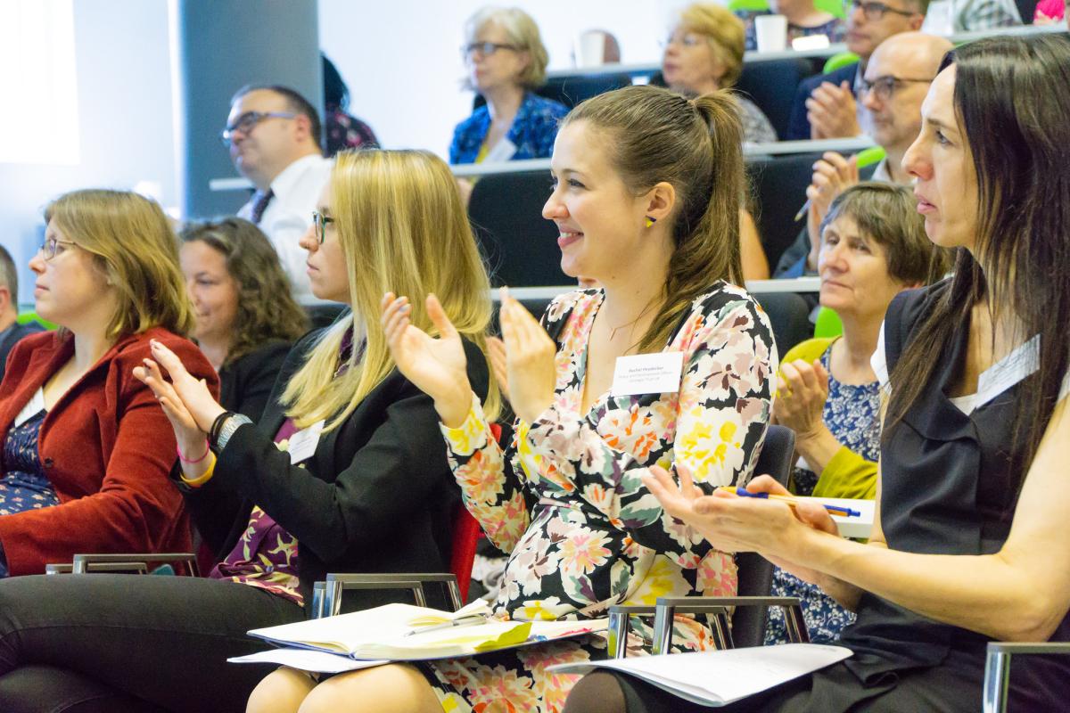 Delegates at 2019 seminar clapping Delegates at 2019 seminar clapping