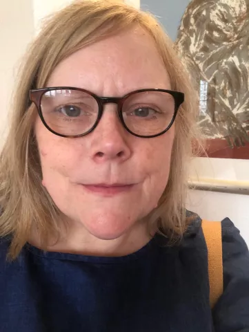 Greenwich librarian Sarah Davis is seen wearing a pair of glasses with black frames.