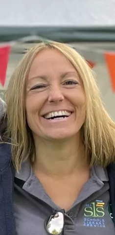 Amy Jeffrey from Hull Schools Library Service smiles broadly into the camera.