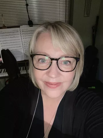 Andrea Hardaker smiles into the camera.