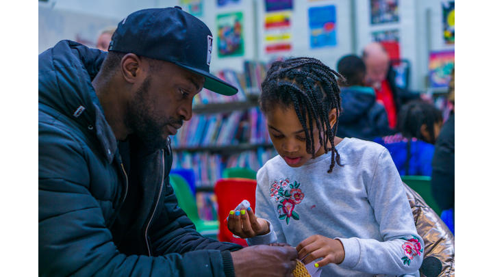 Father and child in a library