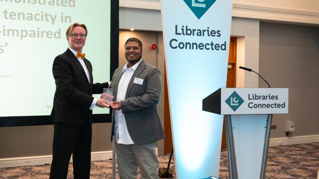 Libraries Connected President Ed Jewell handing a trophy to Muhammad Haque, London Borough of Barking and Dagenham Libraries