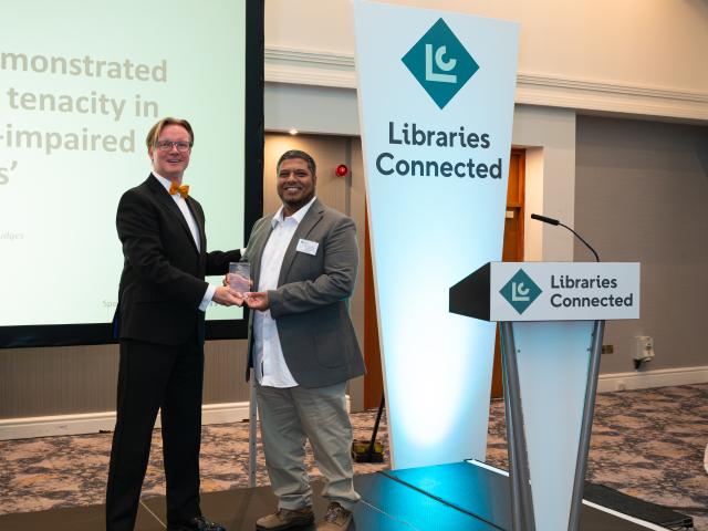 Libraries Connected President Ed Jewell handing a trophy to Muhammad Haque, London Borough of Barking and Dagenham Libraries