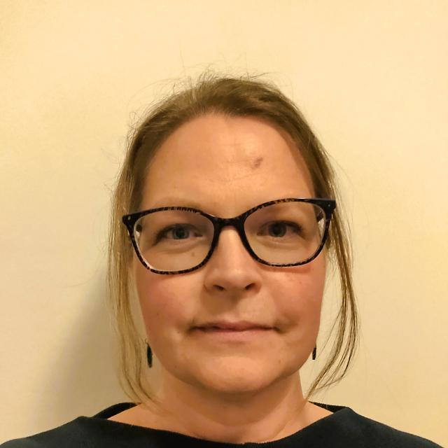 Miranda Phillips is seen looking into the camera with a neutral expression.