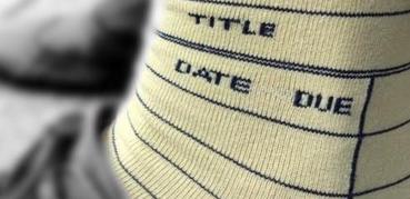 'Date Due' is written on a pair of pale yellow socks